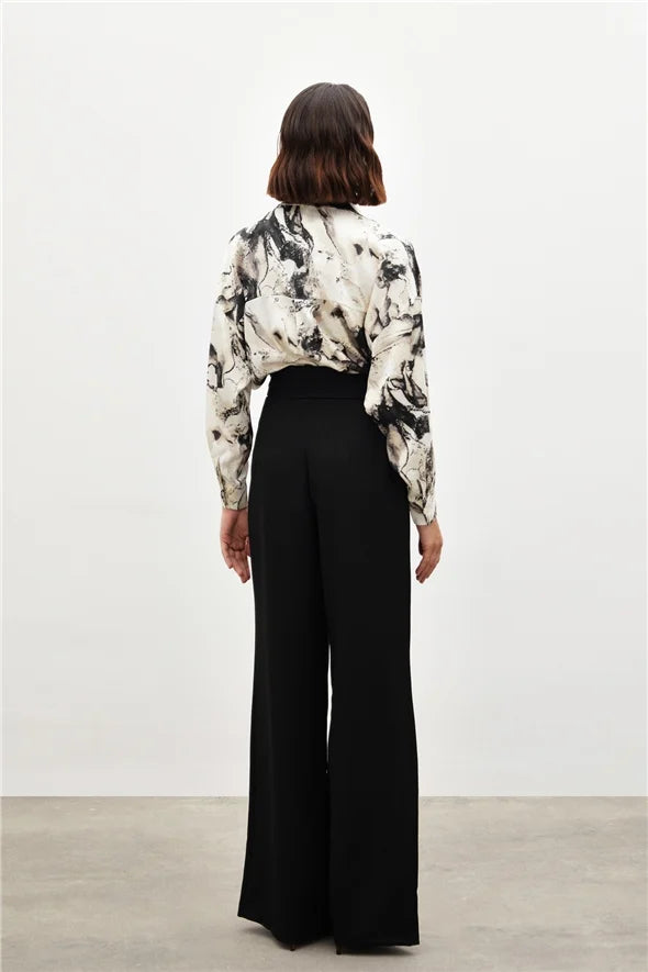 Pantalon large taille haute à boutons dorés