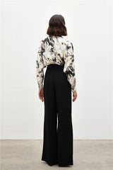 Pantalon large taille haute à boutons dorés