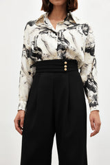 Pantalon large taille haute à boutons dorés